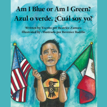 A young boy with a hummingbird shirt holds up the United States flag in his right hand and the Mexican flag in his left hand