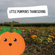 A small orange pumpkin with a cute smiling face is sitting in a pumpkin patch.