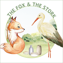 A fox and a stork, and some dinnerware. 